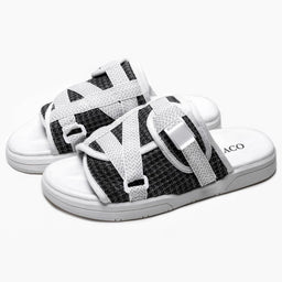 These are open-toe slide sandals with multiple white fabric straps over a black mesh upper and a white sole. The styling reads as sporty and casual, suitable for both men’s and women’s casual wear; the straps appear adjustable for a secure fit. Visible materials include white woven bands and a black mesh/knit fabric, with a cushioned white sole and light gray outsole.