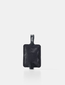 Black toiletry bottle with a strap on a white background