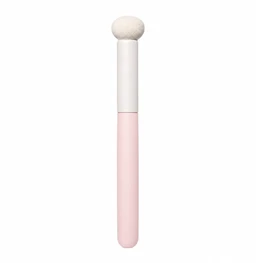 A small rounded white sponge tip on a pink and white cylindrical makeup brush handle, shown against a plain white background.