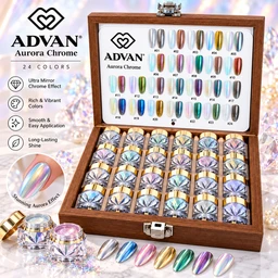 A wooden display case with a hinged lid holds rows of jars filled with iridescent chrome nail powder in gold, silver, blue, and pink tones, with a color chart inside the lid.