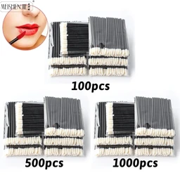 Bundles of black-handled disposable lip applicator brushes with white fibre tips, stacked in piles labelled 100pcs, 500pcs and 1000pcs, with a small inset photo of a red-lipstick mouth in the top left corner.