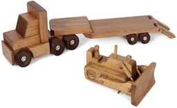 A wooden toy semi truck pulling a low-boy flatbed trailer, with a wooden bulldozer beside it, all in a warm natural oak-brown stain against a white background.