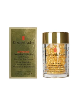 A clear glass jar with a gold lid holding golden serum capsules, beside a green and gold box labeled Elizabeth Arden Advanced Ceramide Capsules.