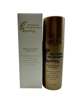 A cream-and-gold box beside a brown pump-top bottle of Ken Paves Repair & Nourish Shine Serum, both printed with white and gold text on a plain white background.