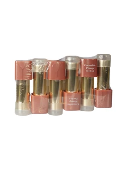 Six nude-pink lipstick tubes with gold bodies and rose-coloured caps are shrink-wrapped together in a bundle against a white background.