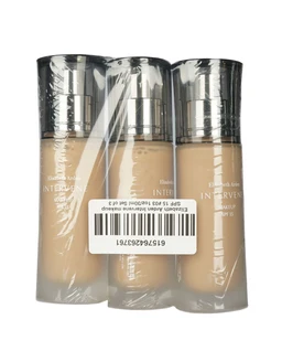 Three clear-wrapped bottles of beige liquid foundation with silver pump tops, labeled Elizabeth Arden Intervene, bundled together in plastic with a barcode on the front.