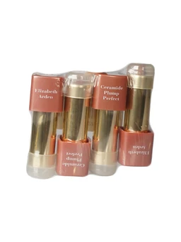 Four gold-tone lipstick tubes with terracotta-brown caps, bundled together in clear plastic wrap on a white background.