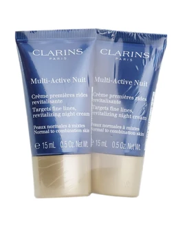 Two small blue plastic tubes of Clarins Multi-Active Nuit night cream sit side by side on a white background, each with a gold-toned cap and white and blue labeling.