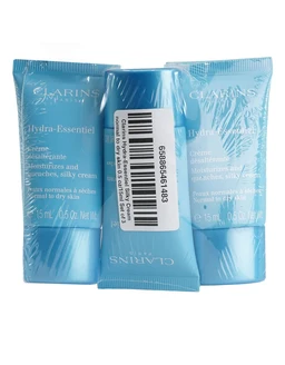 Three blue plastic tubes of Clarins Hydra-Essentiel silky cream, each 15 ml, lying side by side in clear wrapping, with a barcode on the centre tube against a white background.
