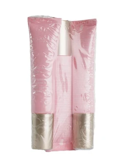 Three pink tubes and a slim pink-and-silver eye applicator sealed together in clear plastic wrap against a white background.