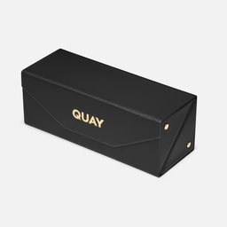 A two-piece frame case in black with a hard, structured silhouette. It features a gold-toned logo (QUAY) on the side and gold hardware at the edges, suggesting a sleek, luxury-inspired finish. The overall look is unisex and suitable for eyewear, with a minimal, modern styling and a faux leather–like exterior.