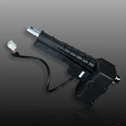 A black plastic linear actuator with a silver metal rod extending from one end and a black power cable with a white connector plug on the other.
