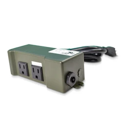 A dark green rectangular power control box with two outlet sockets on its top face, a black power cord coming out of one end, and a round dial on its front side, shown on a white background.