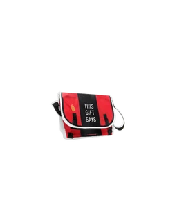 This is a small crossbody bag with a red body and black-and-white trim. The styling is unisex, casual, with an adjustable shoulder strap and a flap opening that features a bold black panel with white text. Visible material appears to be lightweight fabric or canvas with contrasting piping in white.